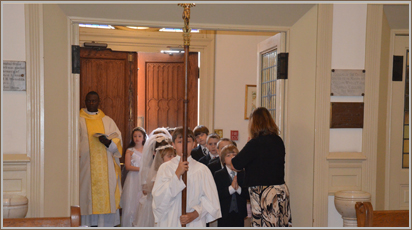 The Director of Religious Education prepares children of the parish for their first reception of Holy Communion.